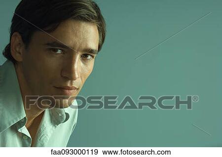 Man confidently looking at camera, portrait View Large Photo Image Stock Photo - Man confidently looking at camera, portrait. Fotosearch