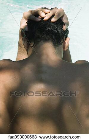 Man holding head in hands, rear view View Large Photo Image Stock Image - Man holding head in hands, rear view. Fotosearch