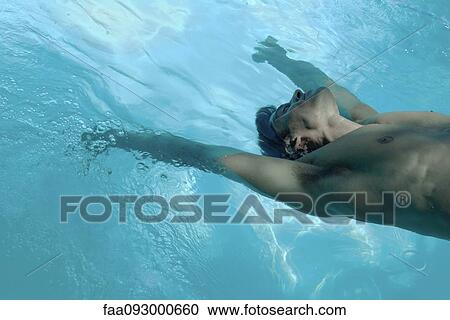 Man leaning backward into swimming pool View Large Photo Image Stock Image - Man leaning backward into swimming pool. Fotosearch