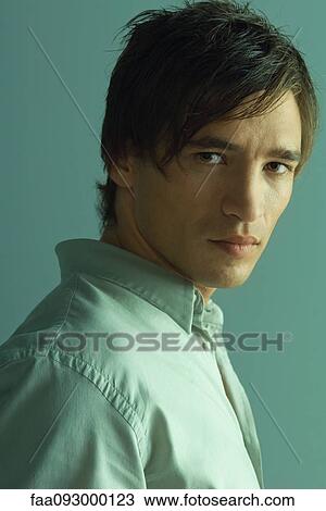Man staring at camera, portrait View Large Photo Image Stock Image - Man staring at camera, portrait. Fotosearch