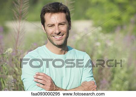 Stock Photography - Mature man enjoying outdoors, portrait. Fotosearch