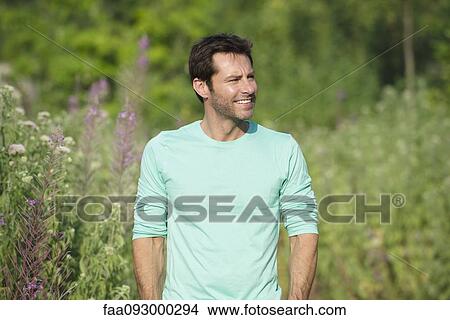 Mature man exploring outdoors, portrait View Large Photo Image Picture - Mature man exploring outdoors, portrait. Fotosearch