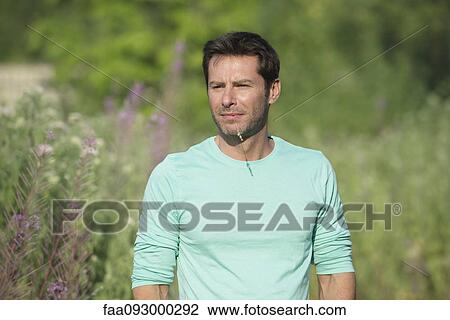 Mature man exploring outdoors, portrait View Large Photo Image Stock Image - Mature man exploring outdoors, portrait. Fotosearch