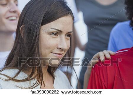 Mid-adult woman at outdoor sports match View Large Photo Image Stock Image - Mid-adult woman at outdoor sports match. Fotosearch