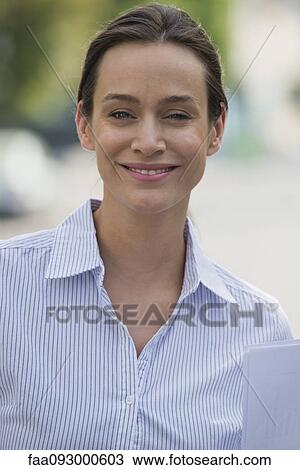 Stock Image - Mid-adult woman, portrait. Fotosearch
