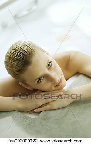 Portrait of young woman, smiling View Large Photo Image Stock Image - Portrait of young woman, smiling. Fotosearch
