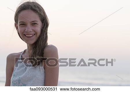 Preteen girl at beach, portrait View Large Photo Image Stock Image - Preteen girl at beach, portrait. Fotosearch