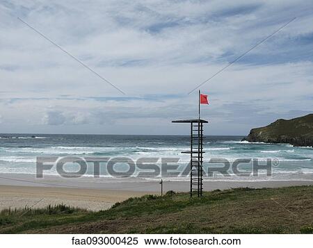 Red flag indicating dangerous conditions at empty beach View Large Photo Image Stock Photography - Red flag indicating dangerous conditions at empty beach. Fotosearch