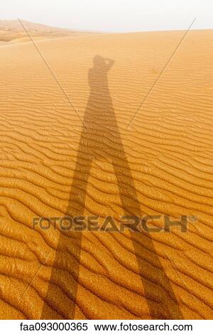 Self portrait of shadow on desert sand View Large Photo Image Stock Photography - Self portrait of shadow on desert sand. Fotosearch