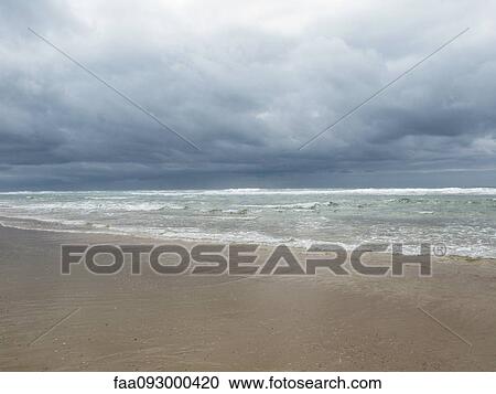 Storm clouds over beach View Large Photo Image Stock Image - Storm clouds over beach. Fotosearch