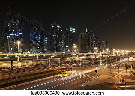 Taxi on city street at night View Large Photo Image Stock Image - Taxi on city street at night. Fotosearch