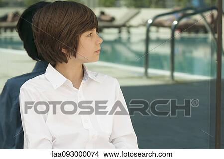 Teenage boy sitting alone View Large Photo Image Picture - Teenage boy sitting alone. Fotosearch