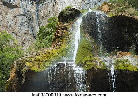 Stock Photo - Tranquil waterfall. Fotosearch