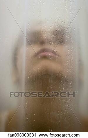 Woman behind wet shower curtain, head back, close-up View Large Photo Image Stock Image - Woman behind wet shower curtain, head back, close-up. Fotosearch
