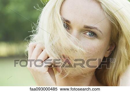 Woman covering face with hair, portrait View Large Photo Image Stock Photography - Woman covering face with hair, portrait. Fotosearch