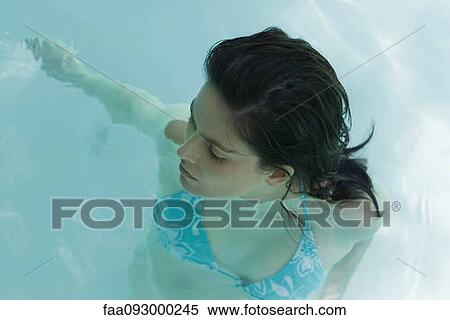 Woman in swimming pool, high angle view View Large Photo Image Stock Photography - Woman in swimming pool, high angle view. Fotosearch