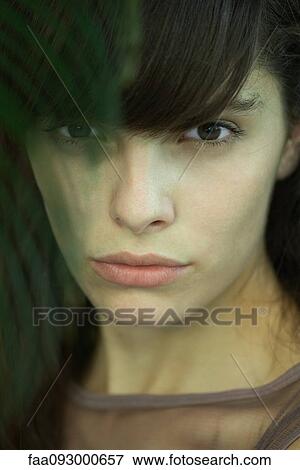 Woman looking at camera, close-up portrait View Large Photo Image Stock Photo - Woman looking at camera, close-up portrait. Fotosearch
