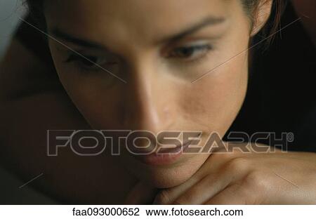 Woman resting head on hand, close-up View Large Photo Image Stock Image - Woman resting head on hand, close-up. Fotosearch