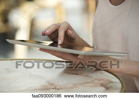 Woman using digital tablet View Large Photo Image Stock Photograph - Woman using digital tablet. Fotosearch
