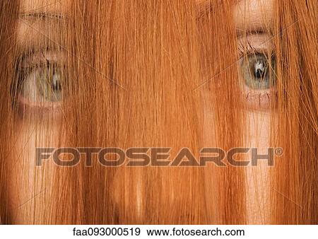 Woman with hair in front of face, close-up View Large Photo Image Stock Photo - Woman with hair in front of face, close-up. Fotosearch
