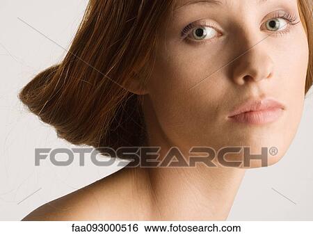 Stock Photograph - Woman with rolled up hairstyle. Fotosearch