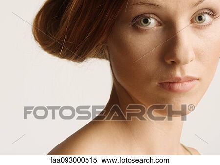 Stock Photography - Woman with rolled up hairstyle. Fotosearch
