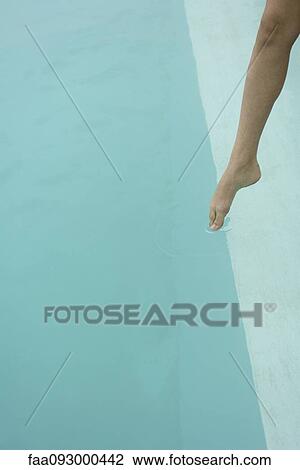 Woman's bare leg, touching surface of water with toe View Large Photo Image Stock Image - Woman's bare leg, touching surface of water with toe. Fotosearch