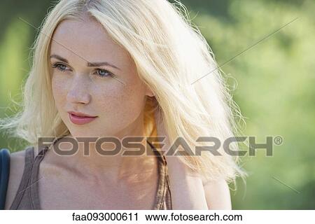 Young woman daydreaming, portrait View Large Photo Image Stock Image - Young woman daydreaming, portrait. Fotosearch
