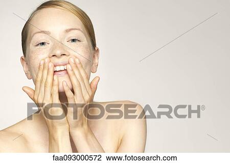 Young woman enjoying soft and smooth results of proper skin care View Large Photo Image Stock Image - Young woman enjoying soft and smooth results of proper skin care. Fotosearch