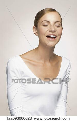 Young woman laughing View Large Photo Image Stock Image - Young woman laughing. Fotosearch