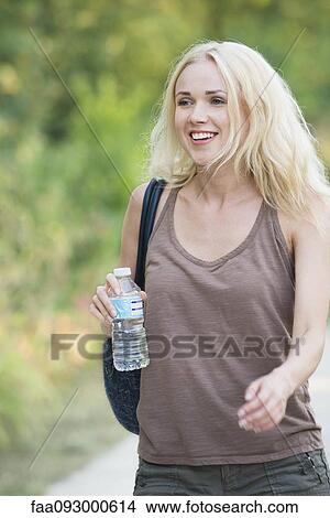Picture - Young woman on the move. Fotosearch