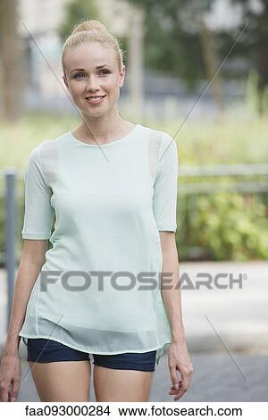 Young woman on the move, portrait View Large Photo Image Picture - Young woman on the move, portrait. Fotosearch