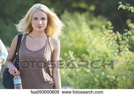 Stock Photo - Young woman on the move. Fotosearch