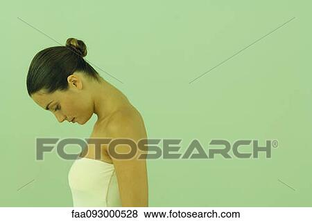 Young woman with head down, profile View Large Photo Image Stock Photo - Young woman with head down, profile. Fotosearch
