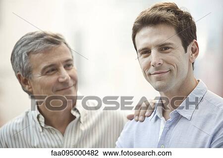 Adult son and father, portrait View Large Photo Image Stock Image - Adult son and father, portrait. Fotosearch