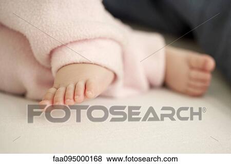 Stock Photo - Baby's feet, cropped. Fotosearch