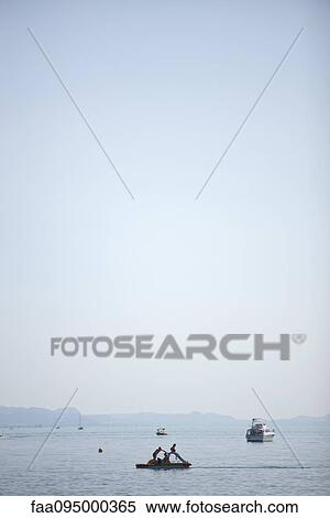 Boats in lake View Large Photo Image Stock Photography - Boats in lake. Fotosearch