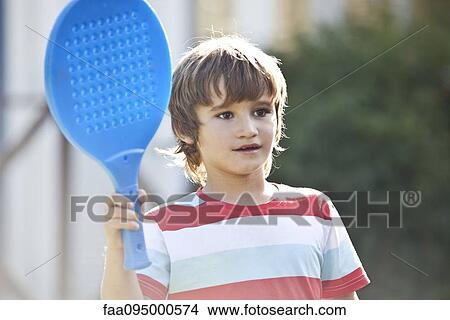 Boy holding racket View Large Photo Image Picture - Boy holding racket. Fotosearch