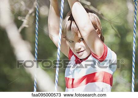 Boy on swing, portrait View Large Photo Image Stock Image - Boy on swing, portrait. Fotosearch