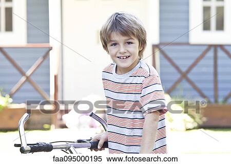 Boy with bicycle View Large Photo Image Stock Photography - Boy with bicycle. Fotosearch