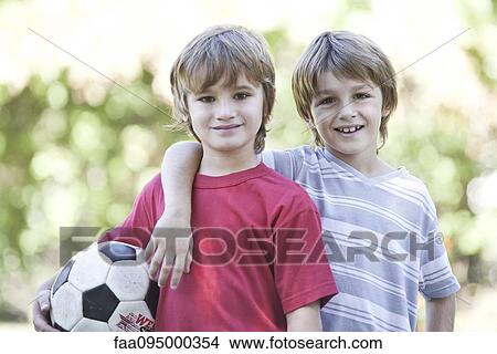 Picture - Boys with soccer ball, portrait. Fotosearch