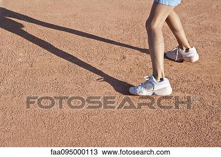 Child standing on tennis court, low section View Large Photo Image Stock Image - Child standing on tennis court, low section. Fotosearch