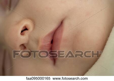 Close-up of baby's mouth and nose, cropped View Large Photo Image Stock Photography - Close-up of baby's mouth and nose, cropped. Fotosearch