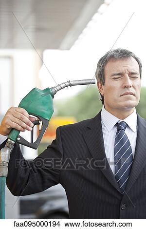 Picture - Consumers with few alternatives express frustration as gas prices soar and oil industry profits grow. Fotosearch