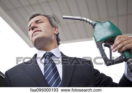 Stock Image - Consumers with few alternatives express frustration as gas prices soar and oil industry profits grow. Fotosearch