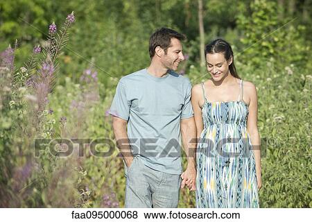 Stock Photo - Couple on walk in countryside. Fotosearch