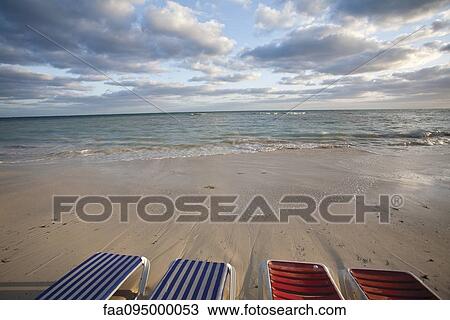 Empty deckchairs on beach View Large Photo Image Stock Image - Empty deckchairs on beach. Fotosearch