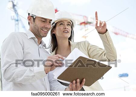 Engineers at construction site View Large Photo Image Stock Image - Engineers at construction site. Fotosearch