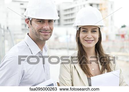 Stock Image - Engineers at construction site. Fotosearch