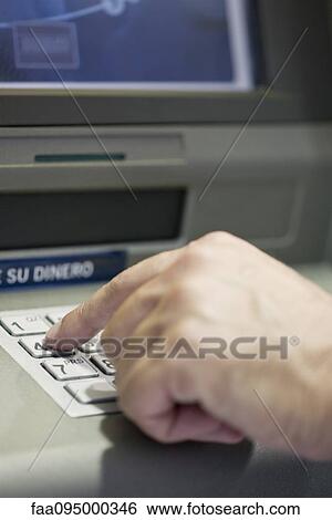 Stock Photograph - Entering security pin at ATM. Fotosearch
